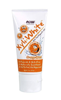 Tube of Now Solutions Kiki White Kids Toothpaste & Gel with orange flavor on a white background