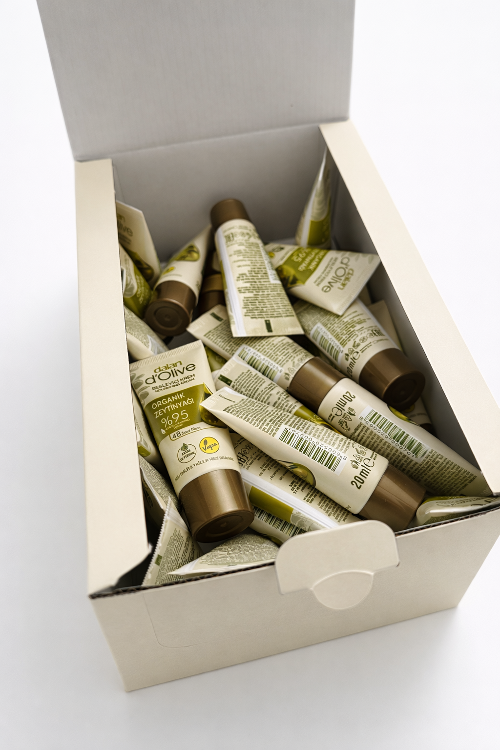 Box of skincare products with tubes on a white background